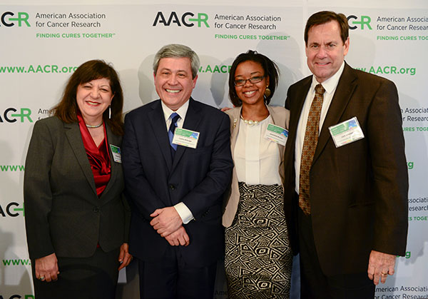 AACR CEO Margaret Foti, PhD, MD (hc), with AACR President Carlos L. Arteaga, MD, and cancer survivors Jameisha Brown and Jack Whelan during the release of the AACR Cancer Progress Report 2014 held at the National Press Club in Washington, DC, on Sept. 17, 2014. (Photo by Alan Lessig)