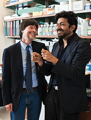 Ken Burns, left, and Siddhartha Mukherjee at Columbia Medical School Cancer Research Lab. Photo by Michael Weschler.