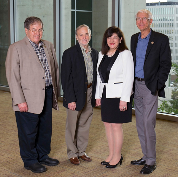 Margaret Foti, PhD, MD (hc), with (left to right) AACR Fellows George F. Vande Woude, PhD, Stephen Baylin, MD, and Peter A. Jones, PhD, DSc, of the Van Andel Institute. Baylin and Jones lead the VARI-SU2C Epigenetics Dream Team. Photo courtesy of the Van Andel Institute.