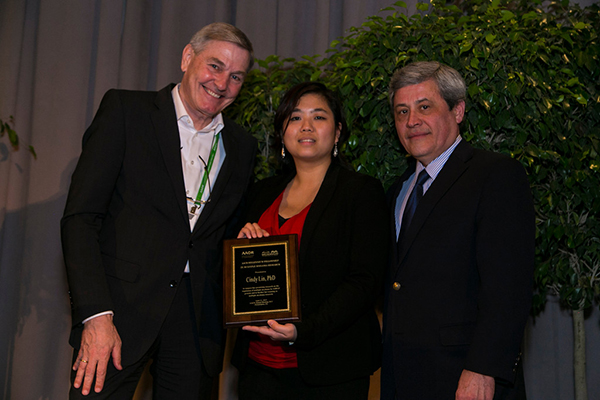 Cindy Lin, PhD, (center) received the AACR-Millennium Fellowship in Multiple Myeloma Research at the 2015 AACR Annual Meeting Grants Dinner. Presenting Lin with the award is Manfred Lehnert, MD, (left) vice president and head of Innovation at Takeda Pharmaceuticals and Carlos L. Arteaga, MD, past-president of the AACR. Photo by © AACR/Todd Buchanan 2015 
