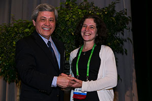 Yvonne Saenger, MD, receives her grant award from AACR Past President Carlos Arteaga, MD, at the AACR Annual Meeting 2015. Photo by © AACR/Todd Buchanan 2015 